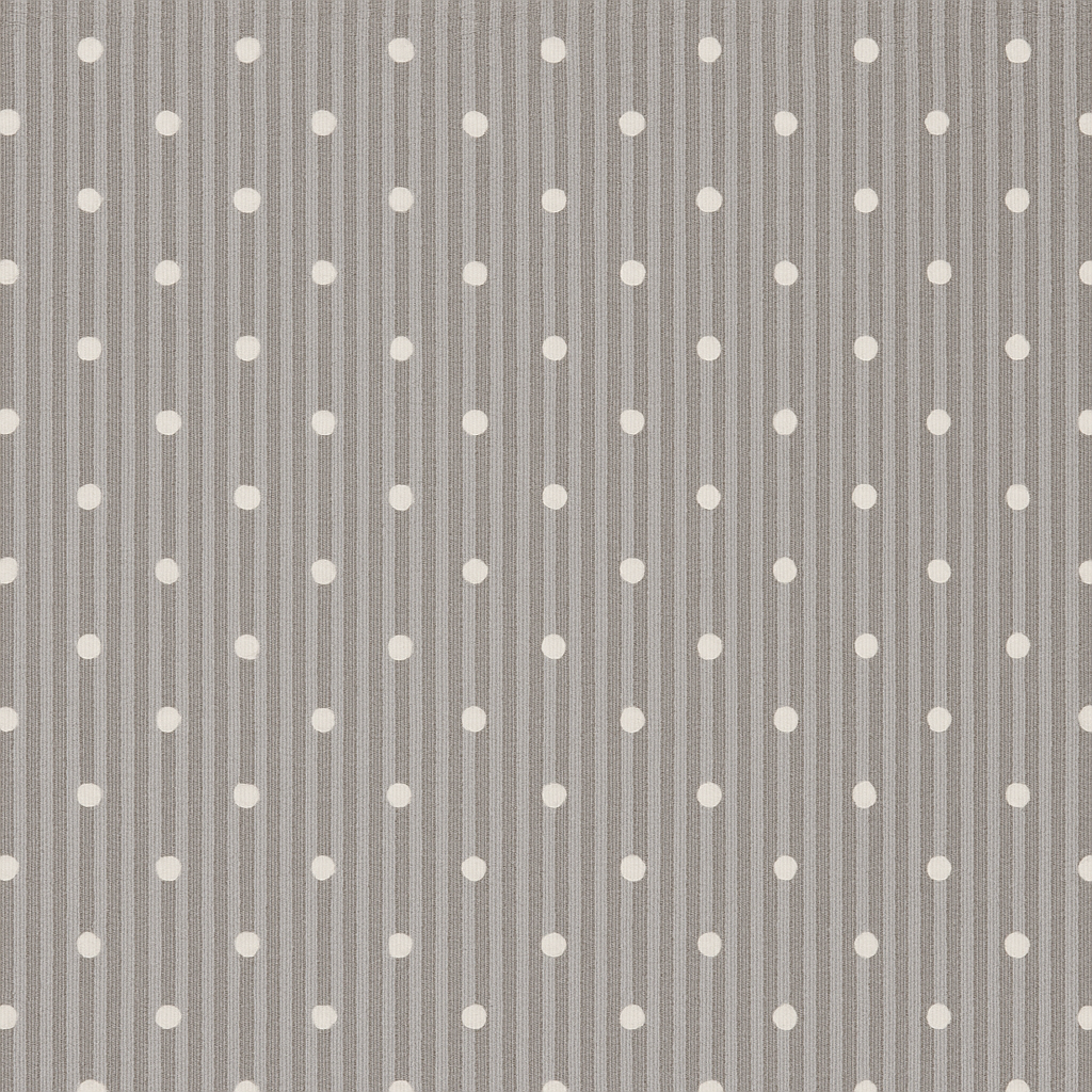 The woman chooses the fabric on the sofa. Textile industry background. Tissue catalog